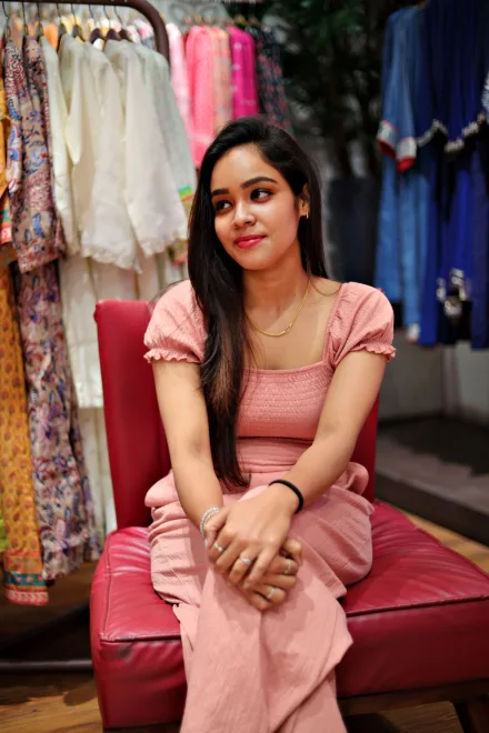 A woman sitting in a boutique